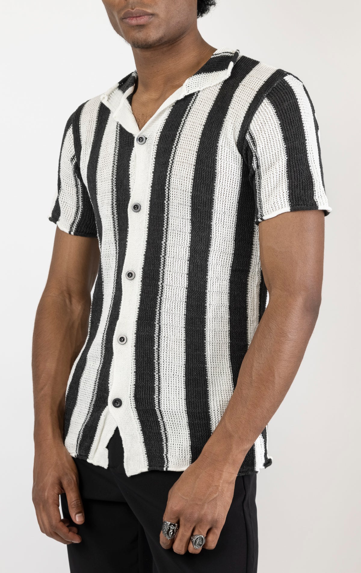 Men's openwork knit polo tee. The polo tee is made from a high-quality openwork knit fabric (50% cotton, 50% acrylic) and features a tailored fit, a classic polo collar with buttons, and short sleeves with intricate openwork detailing throughout the fabric.